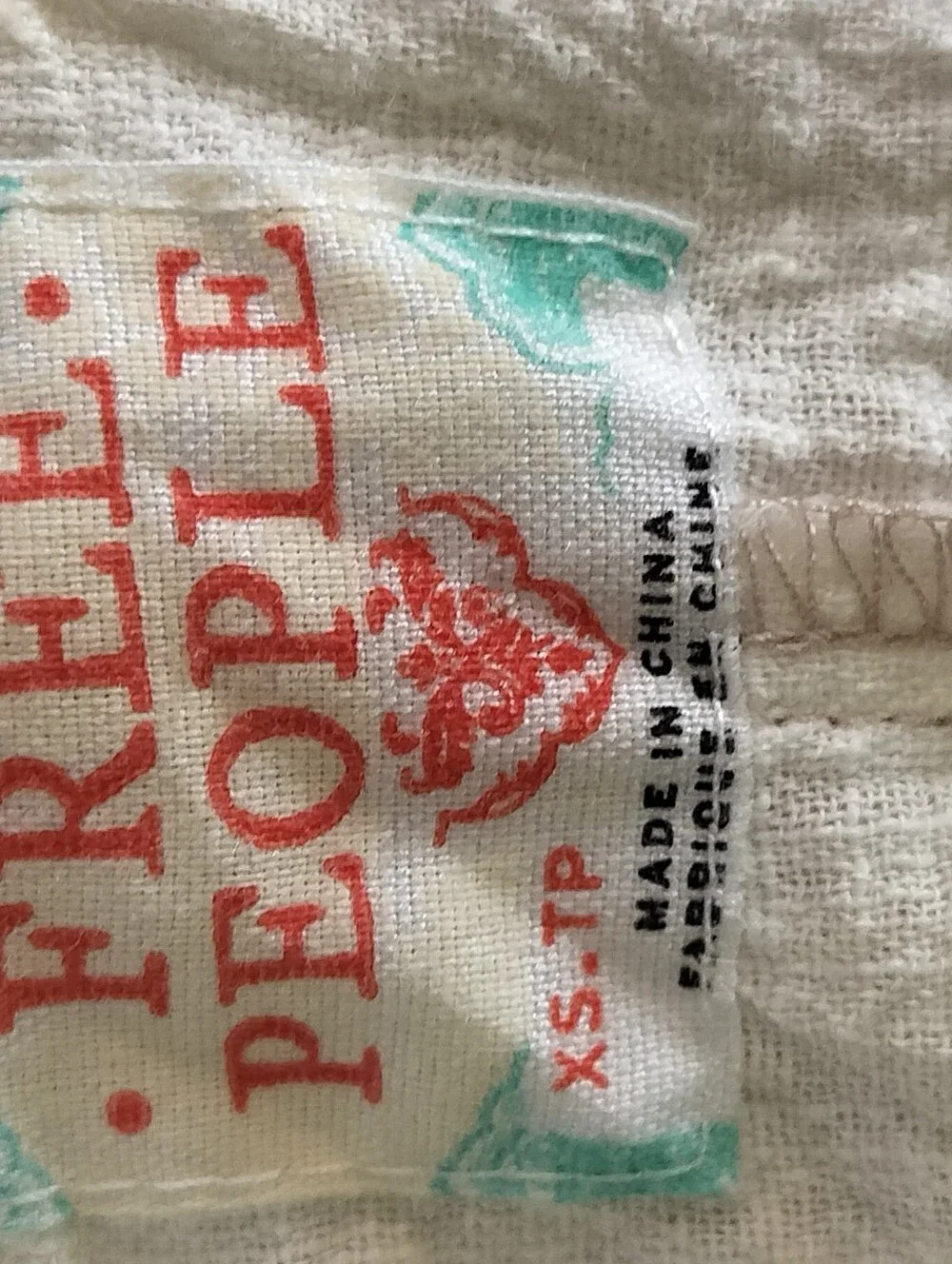 Free People Cream Textured Romper with Coral Logo Detail